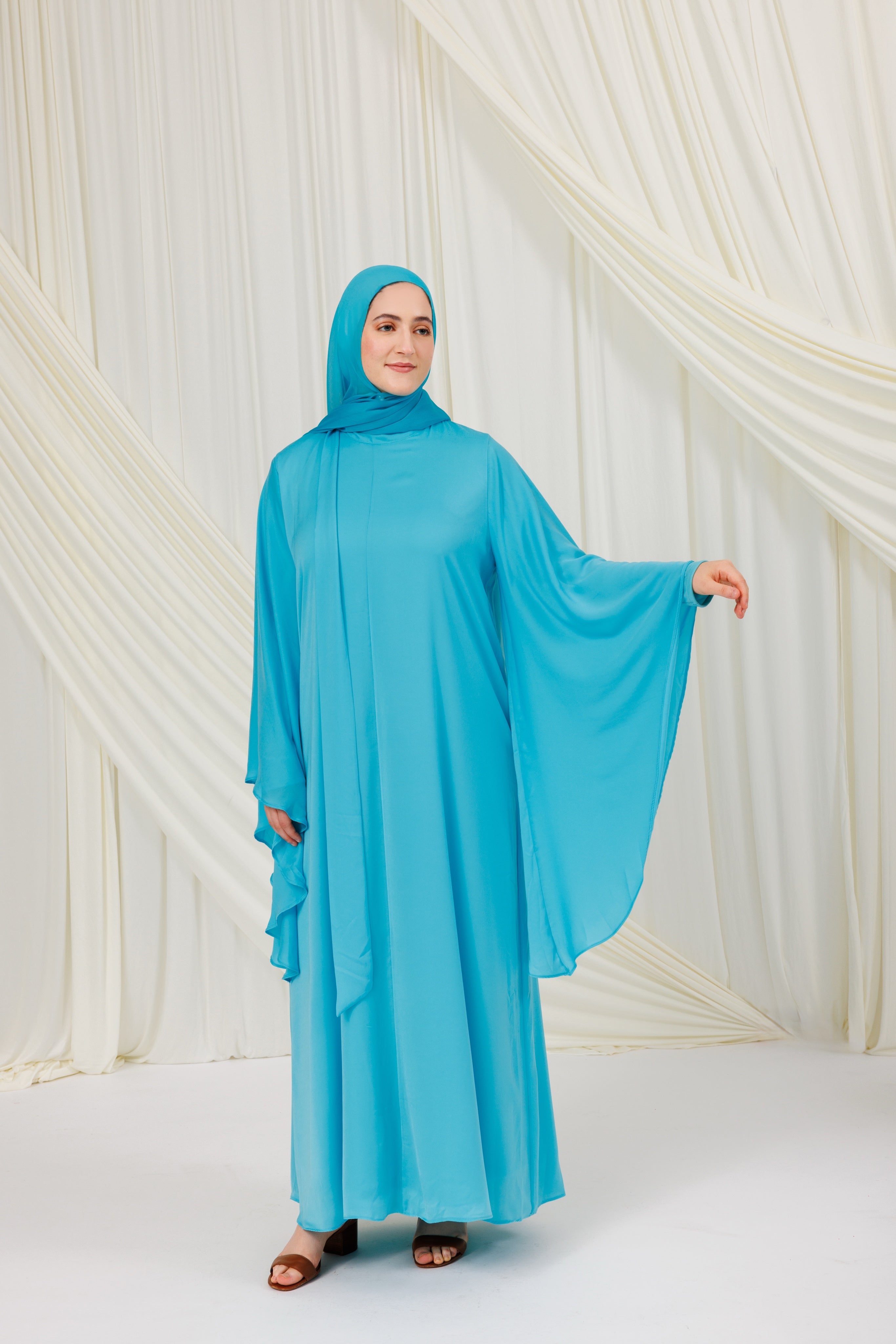 aquamarine blue dress Isalina stretch material Print placement may vary Please refer to the care label on your garment for specific instructions on how to care for it Model wears XS Length from bust to hem Cordelia Dress Aquamarine TOVE